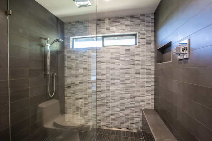 A shower installation gives Westminster, Colorado homeowners a luxury vibe with patterned tile